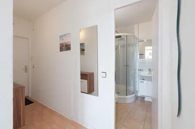 Ein Badezimmer in der Unterkunft Ginys Meerblick Appartement