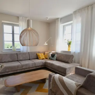 Ein Sitzbereich in der Unterkunft Schöne Aussicht Rosenhagen Haus 3