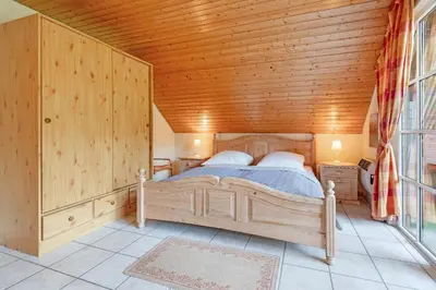 Ein Bett oder Betten in einem Zimmer der Unterkunft Ferienparadies Seeweg 16