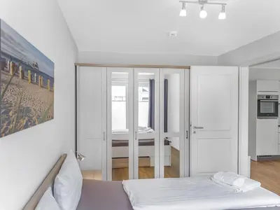 Ein Bett oder Betten in einem Zimmer der Unterkunft Objekt-Nr 234 - Priwall - Mecklenburger Landstraße