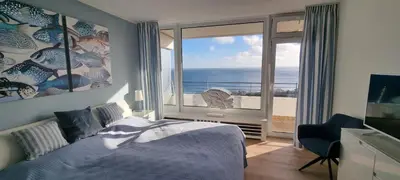 Ein Bett oder Betten in einem Zimmer der Unterkunft Himmel & Meer Suite