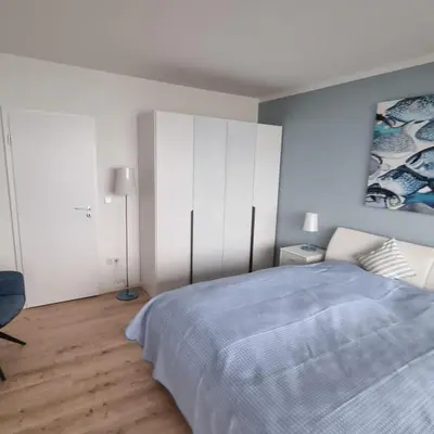 Ein Bett oder Betten in einem Zimmer der Unterkunft Himmel & Meer Suite