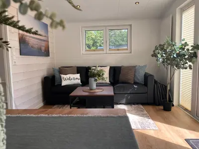 Ein Sitzbereich in der Unterkunft Ostseecamp Ferienhaus 