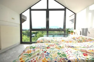 Ein Bett oder Betten in einem Zimmer der Unterkunft Ferienhaus mit Blick über die Felder und Golfplatz