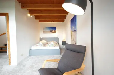 Ein Bett oder Betten in einem Zimmer der Unterkunft Ferienhaus mit Blick über die Felder und Golfplatz