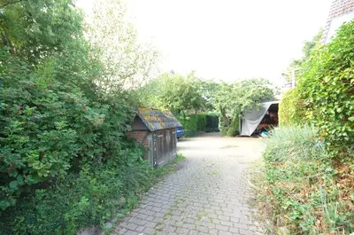 Ein Garten an der Unterkunft Ferienhaus mit Blick über die Felder und Golfplatz