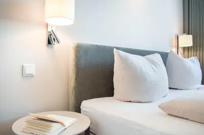Ein Bett oder Betten in einem Zimmer der Unterkunft Ferienwohnung Sun & Stay - Timmendorfer Strand