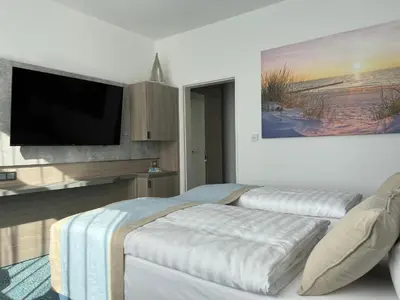 Ein Bett oder Betten in einem Zimmer der Unterkunft Hotel Leuchtturm