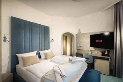 Ein Bett oder Betten in einem Zimmer der Unterkunft Hotel Leuchtturm