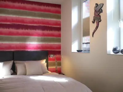 Ein Bett oder Betten in einem Zimmer der Unterkunft Ancora Ferienwohnungen Timmendorfer Strand