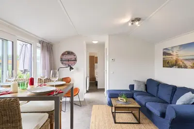 Ein Sitzbereich in der Unterkunft Süsel Seeparx Ferienhaus Seeleuchten