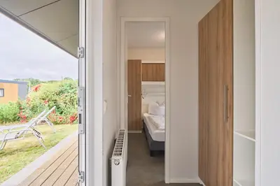 Ein Bett oder Betten in einem Zimmer der Unterkunft Süsel Seeparx Ferienhaus Seeleuchten
