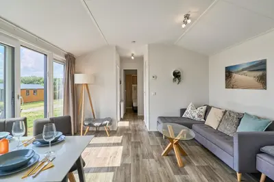 Ein Sitzbereich in der Unterkunft Süsel Seeparx Ferienhaus Tjelle