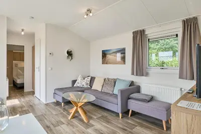 Ein Sitzbereich in der Unterkunft Süsel Seeparx Ferienhaus Tjelle