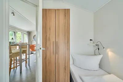 Ein Bett oder Betten in einem Zimmer der Unterkunft Süsel Seeparx Ferienhaus Se e hnsucht