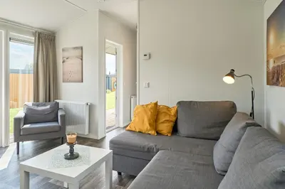 Ein Sitzbereich in der Unterkunft Süsel Seeparx Ferienhaus Seebrise
