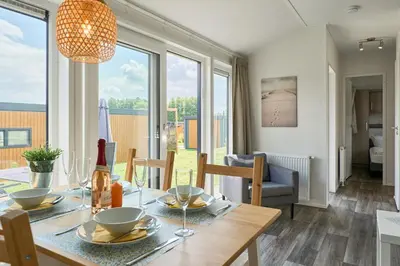 Ein Sitzbereich in der Unterkunft Süsel Seeparx Ferienhaus Seebrise