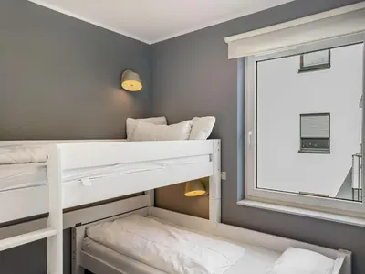 Ein Bett oder Betten in einem Zimmer der Unterkunft Objekt-Nr 196 - Priwall - Fliegerweg