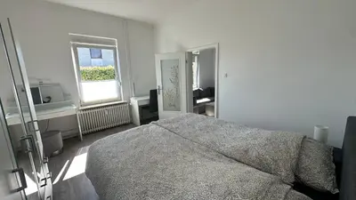 Ein Bett oder Betten in einem Zimmer der Unterkunft Hansestube zentrale 3 Zimmer Ferienwohnung mit Terrasse 73m2