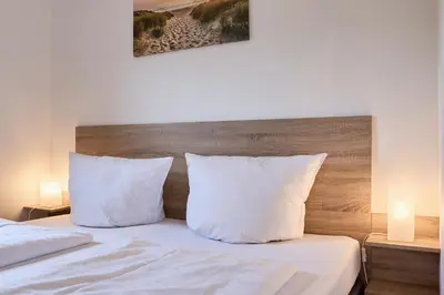 Ein Bett oder Betten in einem Zimmer der Unterkunft Süsel Seeparx Ferienhaus Wellenkönig