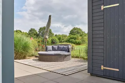 Ein Garten an der Unterkunft Süsel Seeparx Ferienhaus Wellenkönig