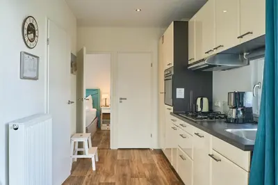 Küche/Küchenzeile in der Unterkunft Süsel Seeparx Ferienhaus Victoria