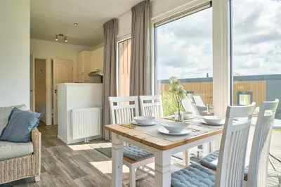 Ein Sitzbereich in der Unterkunft Süsel Seeparx Ferienhaus Biene