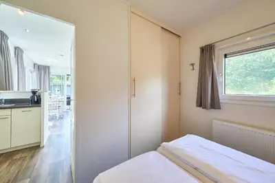 Ein Bett oder Betten in einem Zimmer der Unterkunft Süsel Seeparx Ferienhaus Biene