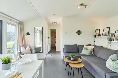 Ein Sitzbereich in der Unterkunft Süsel Seeparx Ferienhaus Haus am See