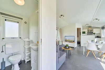 Ein Sitzbereich in der Unterkunft Süsel Seeparx Ferienhaus Haus am See