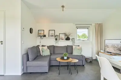 Ein Sitzbereich in der Unterkunft Süsel Seeparx Ferienhaus Haus am See