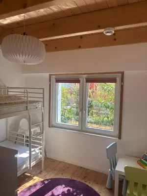 Ein Bett oder Betten in einem Zimmer der Unterkunft Familienfreundliches Ferienhaus am Priwallstrand