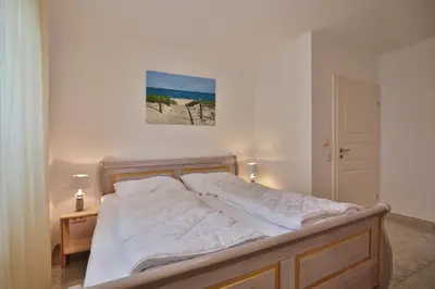 Ein Bett oder Betten in einem Zimmer der Unterkunft Ostsee-Domizil App 1
