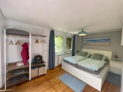 Ein Bett oder Betten in einem Zimmer der Unterkunft Ostseeferienwohnung Storchennest Zwei
