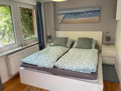Ein Bett oder Betten in einem Zimmer der Unterkunft Ostseeferienwohnung Storchennest Zwei