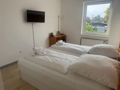 Ein Bett oder Betten in einem Zimmer der Unterkunft M2 Rooms