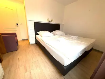 Ein Bett oder Betten in einem Zimmer der Unterkunft M2 Rooms