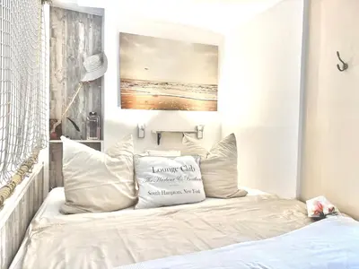 Ein Bett oder Betten in einem Zimmer der Unterkunft Freibeuter Appartement Nr 27 Scharbeutz