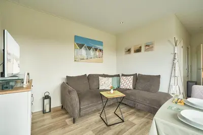 Ein Sitzbereich in der Unterkunft Süsel Seeparx Ferienhaus Windspiel