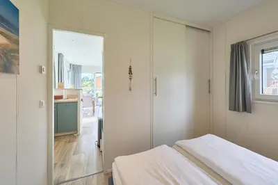 Ein Bett oder Betten in einem Zimmer der Unterkunft Süsel Seeparx Ferienhaus Windspiel