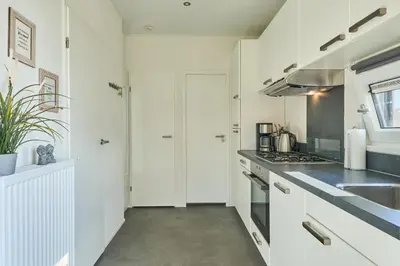 Küche/Küchenzeile in der Unterkunft Süsel Seeparx Ferienhaus Chalet Relax-Inn