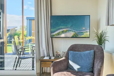 Ein Sitzbereich in der Unterkunft Süsel Seeparx Ferienhaus Chalet Relax-Inn