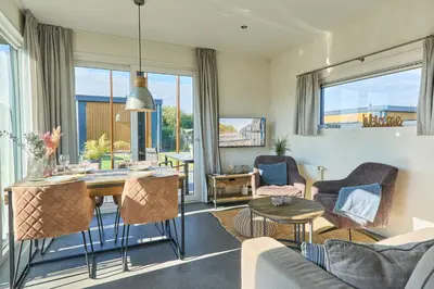 Ein Sitzbereich in der Unterkunft Süsel Seeparx Ferienhaus Chalet Relax-Inn