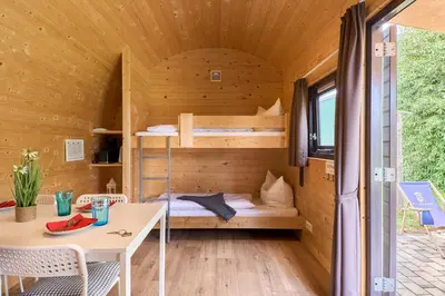 Ein Bett oder Betten in einem Zimmer der Unterkunft Süsel Seeparx Ferienhaus Splash House