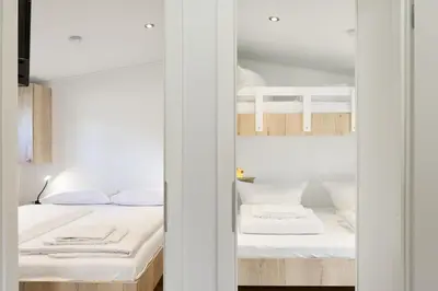 Ein Bett oder Betten in einem Zimmer der Unterkunft Ostseecamp Ferienhaus 