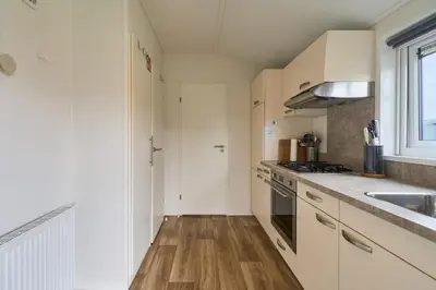 Küche/Küchenzeile in der Unterkunft Süsel Seeparx Ferienhaus Carla