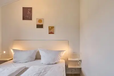 Ein Bett oder Betten in einem Zimmer der Unterkunft Süsel Seeparx Ferienhaus Carla