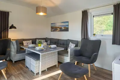Ein Sitzbereich in der Unterkunft Süsel Seeparx Ferienhaus Seezauber