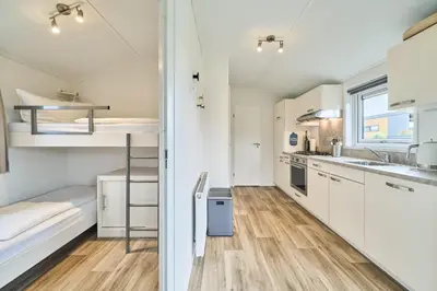 Küche/Küchenzeile in der Unterkunft Süsel Seeparx Ferienhaus Theres