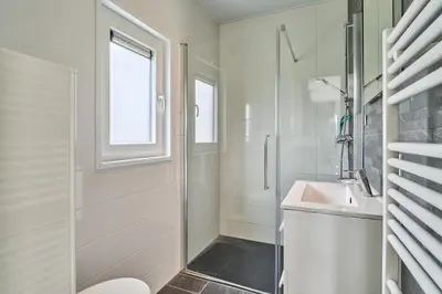 Ein Badezimmer in der Unterkunft Süsel Seeparx Ferienhaus Delphin